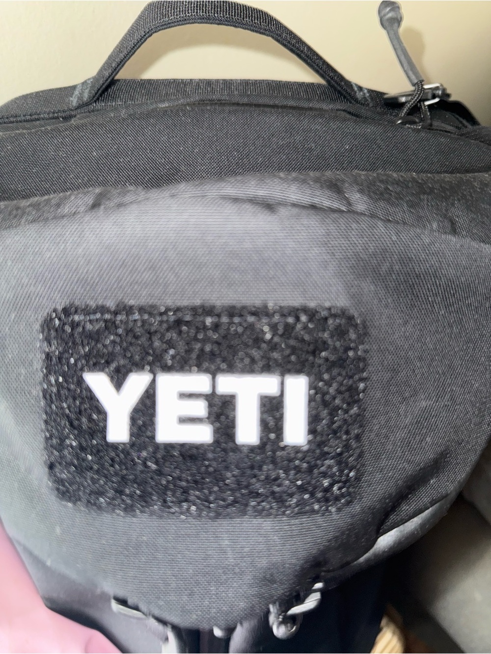 Yeti Black Backpack with Red Bird Patch